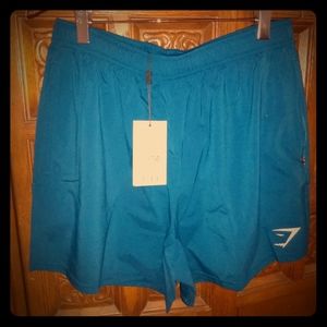 Men/Unisex teal blue gym shorts.Used